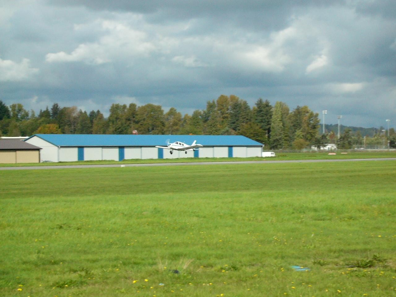 Piper Cherokee GNIC during flare for landing on Runway 19 at Langley Airport. Langley Flying School.